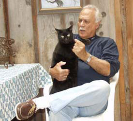Paul sitting on chair holding Holly